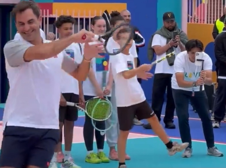 Roger Federer spotted practicing with some kids at a Uniqlo event in Paris